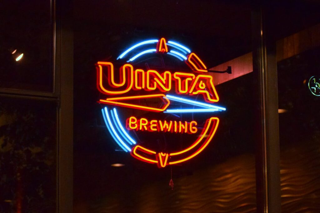 Colorful Uinta Brewing neon sign glowing indoors, ideal for bar or brewery themes.